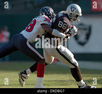 Tampa Bay Buccaneers' wide reciever Thomas Jones (22) tries in vain to  escape a tackle from Houston Texans' centerback Demarcus Faggins (38)  during the Bucs' 16-3 win against the Texans at Raymond