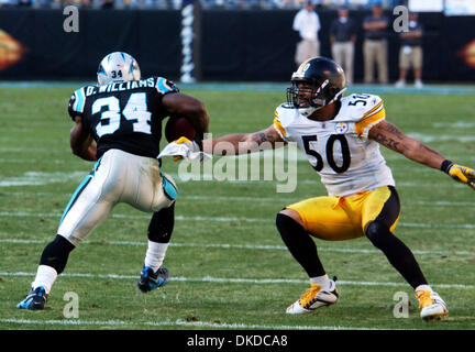 Dec 17, 2006; Charlotte, NC, USA; NFL Football: Carolina Panthers # 34 DEANGELO WILLIAMS tries to avoid being tackled Pittsburgh Steelers # 50 LARRY FOOTE as the Pittsburgh Steelers beat the Carolina Panthers 3-37 as they played at the Bank of America Stadium located in downtown Charlotte. Mandatory Credit: Photo by Jason Moore/ZUMA Press. (©) Copyright 2006 by Jason Moore Stock Photo