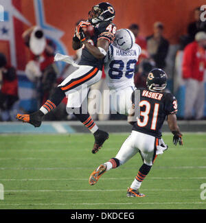 Indianapolis Colts wide receiver Marvin Harrison (88) catches the pass over  Chicago Bears cornerback Nathan Vasher (31) at the beginning of the third  quarter during Super Bowl XLI at Dolphin Stadium in