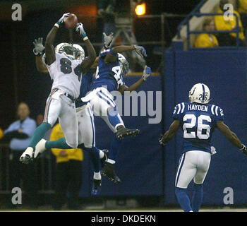 Dec 31, 2006; Indianapolis, IN, USA; Dolphins receiver CHRIS CHAMBERS skies for a catch against the Colts' JASON DAVID at the RCA Dome.  Mandatory Credit: Photo by Damon Higgins/Palm Beach Post/ZUMA Press. (©) Copyright 2006 by Palm Beach Post Stock Photo