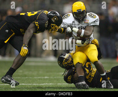 Jan 06, 2007 - San Antonio, TX, USA - 2007 US Army All-American Bowl. West squad's JOE McKNIGHT is tackled by  East squad's ALLEN BAILEY (left) and MARTEZ WILSON Saturday Jan. 6, 2007 at the Alamodome. The West squad went on to win 24-7. Stock Photo
