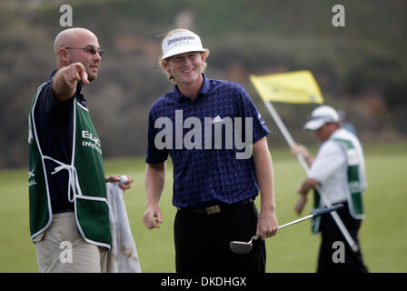 Jan 27, 2007 - San Diego, CA, USA - Buick Invitational, Torrey Pines South golf course, third round. On the third green, BRANDT SNEDEKER plays tourist as his caddie points to something in the Pacific Ocean, probably the group of sea kayakers a mile or so out there. Stock Photo
