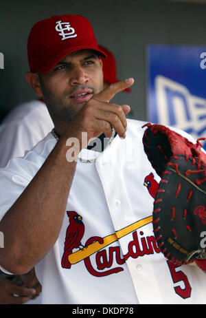 A. J. Pujols, 10, son of St. Louis Cardinals first baseman Albert Pujols,  stretches with the pitchers' group during Cardinals spring training at  Roger Dean Stadium in Jupiter, Florida, Friday, February 18