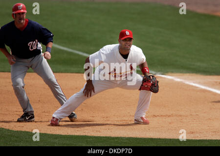 A. J. Pujols, 10, son of St. Louis Cardinals first baseman Albert Pujols,  stretches with the pitchers' group during Cardinals spring training at  Roger Dean Stadium in Jupiter, Florida, Friday, February 18