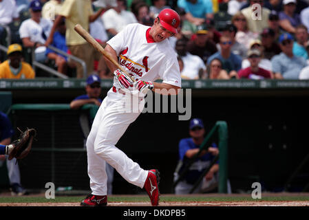 Scott Rolen of the St. Louis Cardinals hold his daughter Raine