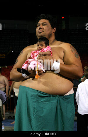 Apr 09, 2007; Los Angeles, California, USA; MARK SAGATO , of Arcadia , CA holding his one month old daughter Aurora during a break at the 7th Annual US Sumo Open held at the Sports Arena in  Los Angeles. Photographed April 07 , 2007  Mandatory Credit: Photo by Jonathan Alcorn/ZUMA Press. (©) Copyright 2007 by Jonathan Alcorn Stock Photo