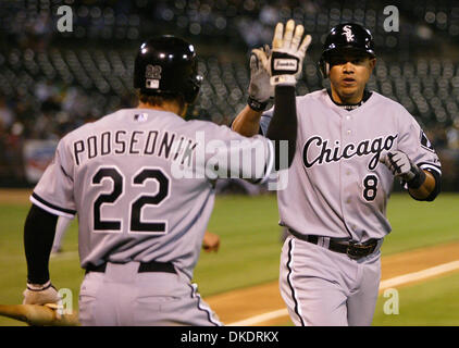 The Chicago White Sox's Scott Podsednik (22) celebrates as teammate Alex Cintron scores during the fifth inning of their game against the Athletics  on Tuesday April 10, 2007 in Oakland, California. (Aric Crabb /The Oakland Tribune) Stock Photo
