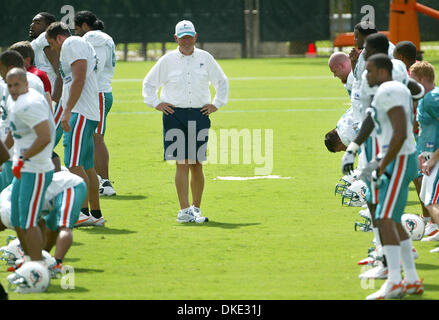 Miami Dolphins head coach Cam Cameron talks to Jason Taylor at Dolphin  Stadium in Miami on