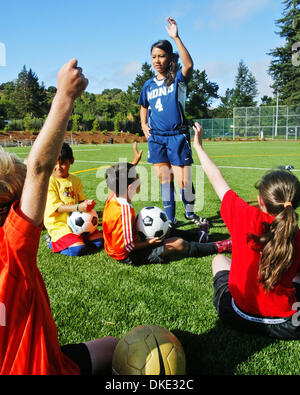 Julie Loucks, a soccer player at Notre Dame de Namur University, in Belmont, Calif; works with kids at a soccer camp, Wednesday, July 25, 2007. John Green/San Mateo County Times Stock Photo