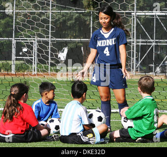 Julie Loucks, a soccer player at Notre Dame de Namur University, in Belmont, Calif; works with kids at a soccer camp, Wednesday, July 25, 2007. John Green/San Mateo County Times Stock Photo