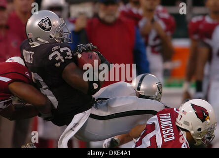 August 11th, 2007 - Oakland, CA, USA -  Oakland Raiders Dominic Rhodes, #33, pushes for extra yardage against the Arizona Cardinals in the 1st quarter of their preseason game on Saturday, August 11, 2007 at McAfee Coliseum in Oakland, Calif. (Credit Image: © Jose Carlos Fajardo/Contra Costa Times/ZUMA Press) Stock Photo