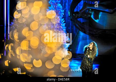 New York, USA. 4th December 2013.  British Singer Leona Lewis performs during the 81st Christmas Tree Lighting Ceremony in Rockefeller Center in New York City, the United States of America, Dec. 4, 2013. Thousands of people filled on Wednesday streets around the Rockefeller Center to watch the moment when 45,000 multi-colored LED lights burst into color on the Christmas tree which is an approximately 12-ton, 76-foot tall, 75-year-old Norway spruce topped with a crystal star. (Xinhua/Zhang Ning/Alamy Live News) Stock Photo