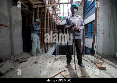 Construction worker on a high rise building site, Nairobi, Kenya Stock Photo