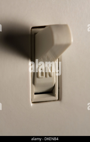 Closeup of a light switch in the 'ON' position Stock Photo