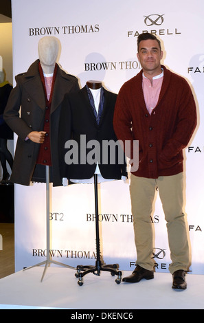 Robbie Williams Robbie Williams launches his menswear clothes label 'Farrell' with designer Ben Dickens at Brown Thomas Dublin Stock Photo