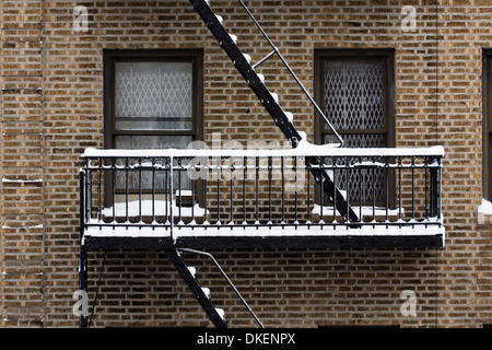 Apartment Building's fire escape covered with snow during Winter Stock Photo