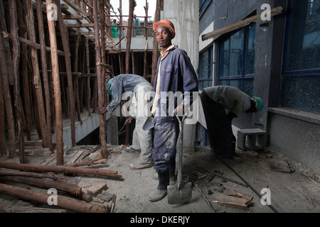 Construction workers on a high rise building site, Nairobi, Kenya Stock Photo