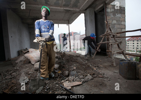 Construction workers on a high rise building site, Nairobi, Kenya Stock Photo