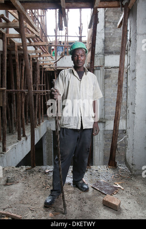 Construction worker on a high rise building site, Nairobi, Kenya Stock Photo
