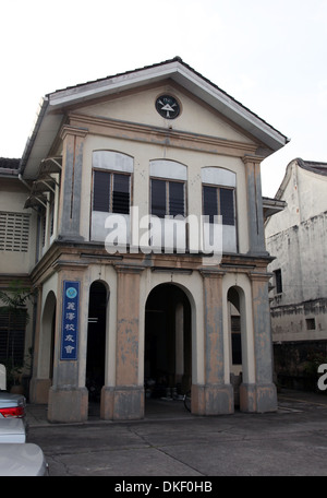 It's a photo in the streets of Georgetown in Penang in Malaysia. We can see a Colonial Building  or tower or arcades Stock Photo