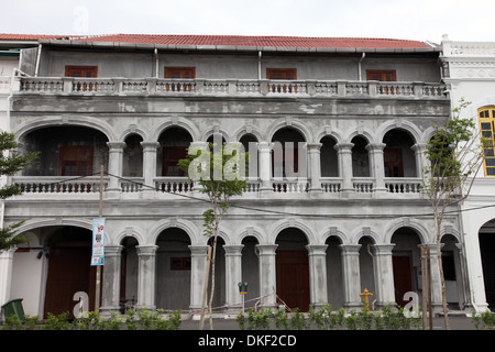 It's a photo in the streets of Georgetown in Penang in Malaysia. We can see a Colonial Building  or tower or arcades Stock Photo