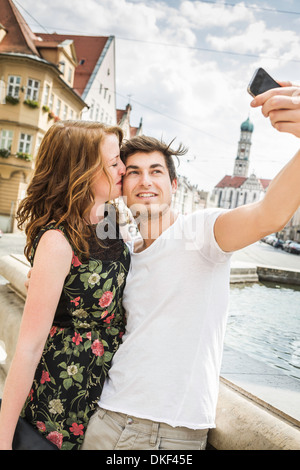 Young couple taking self portrait photograph