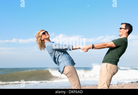 Couple enjoying vacation on beach Stock Photo