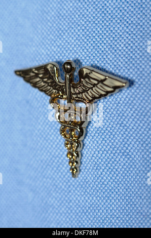 Caduceus pin attached to a shirt Stock Photo