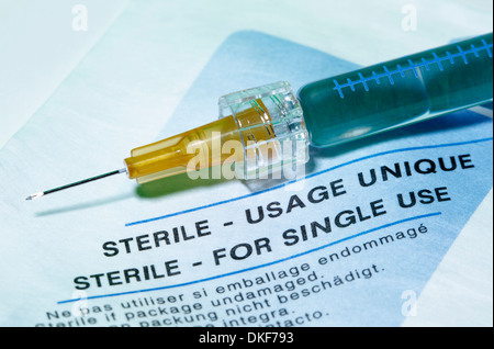 Disposable plastic medical syringe with a hypodermic needle Stock Photo