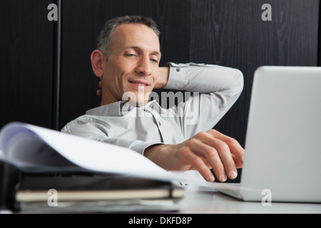 Businessman using laptop Stock Photo