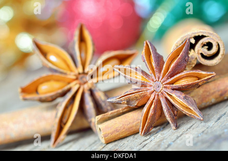extremely closeup view of anise star and cinnamon sticks, on wooden table Stock Photo