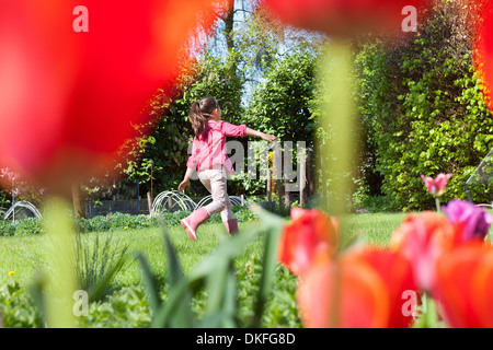 Girl playing in garden Stock Photo