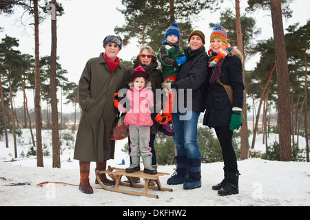 Family portrait of three generations in winter scene Stock Photo