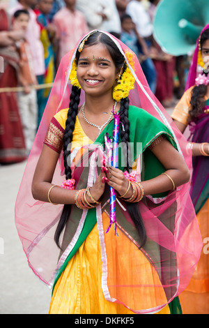 Indian girls in traditional dress dancing at a festival in the streets of Puttaparthi. Andhra Pradesh, India Stock Photo