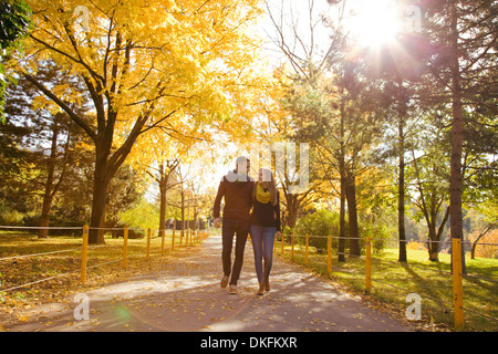 Young couple strolling in autumn park, Vienna, Austria Stock Photo