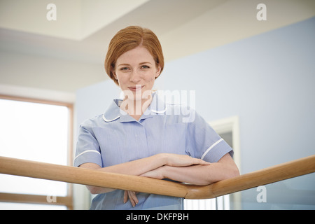 Portrait of female nurse in hospital corridor Stock Photo