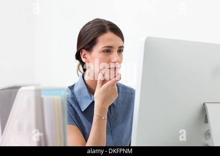 Young woman working on computer Stock Photo