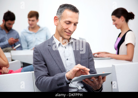 Mature man using digital tablet Stock Photo