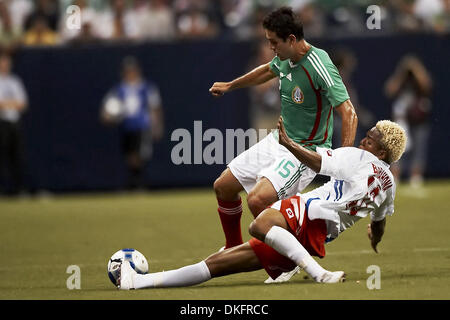 Jul 10, 2009 - Houston, Texas, USA - NELSON BARAHONA (#10) of Panama tackles the ball out from under FAUSTO PINTO (#5) of Mexico.  Panama and Mexico tied 1-1 at Reliant Stadium. (Credit Image: © Diana Porter/Southcreek Global/ZUMA Press) Stock Photo