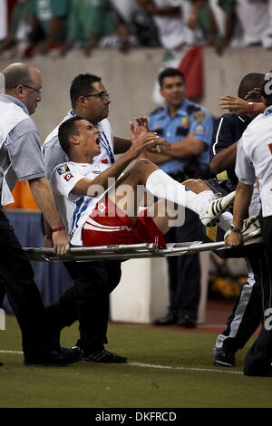 Jul 10, 2009 - Houston, Texas, USA - While being carried off the field, BLAS PEREZ (#7) of Panama is by an bottle thrown at him from the stands.  Panama and Mexico tied 1-1 at Reliant Stadium. (Credit Image: © Diana Porter/Southcreek Global/ZUMA Press) Stock Photo