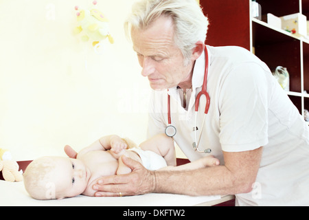 Paediatrician examining baby girl Stock Photo