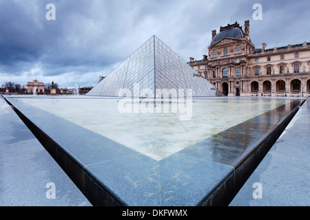 Louvre Museum and pyramid, Paris, Ile de France, France, Europe Stock Photo