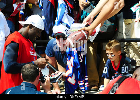 30 July 2009: Wide Reciever Terrell Owens of the Buffalo Bills unveils the  new throwback uniforms after the Bills Thursday night practice at St. John  Fisher College in Pittsford, New York. (Icon