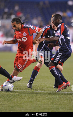 Aug. 02, 2009 - Foxboro, Massachusetts, USA - August 1 2009: Toronto FC midfielder Dwayne De Rosario (14, l) dribbles the ball past New England Revolution forward Kheli Dube (11, r). Toronto FC and the New England Revolution finished with a 1-1 tie at Gillette Stadium in Foxboro, Massachusetts. (Credit Image: © Geoff Bolte/Southcreek Global/ZUMApress.com) Stock Photo