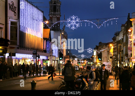 COLCHESTER HIGH STREET IN DECEMBER WITH XMAS LIGHTS SHOWING THE TOWN HALL CLOCK TOWER Stock Photo