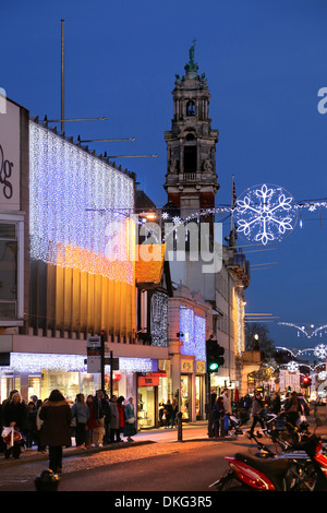 COLCHESTER HIGH STREET IN DECEMBER WITH XMAS LIGHTS SHOWING THE TOWN HALL CLOCK TOWER Stock Photo