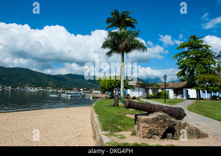 Old cannons on shore of the town of Paraty, Rio de Janeiro, Brazil, South America Stock Photo