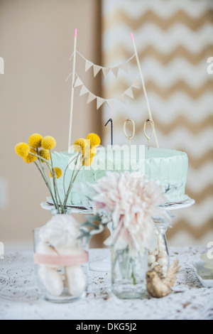 Still life of celebration cake with flowers and decoration Stock Photo