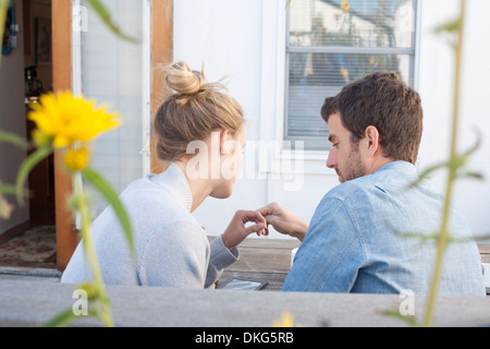 Couple looking at digital tablet, Breezy Point, Queens, New York, USA Stock Photo