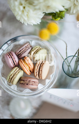 Still life of macaroons with flowers and decoration Stock Photo